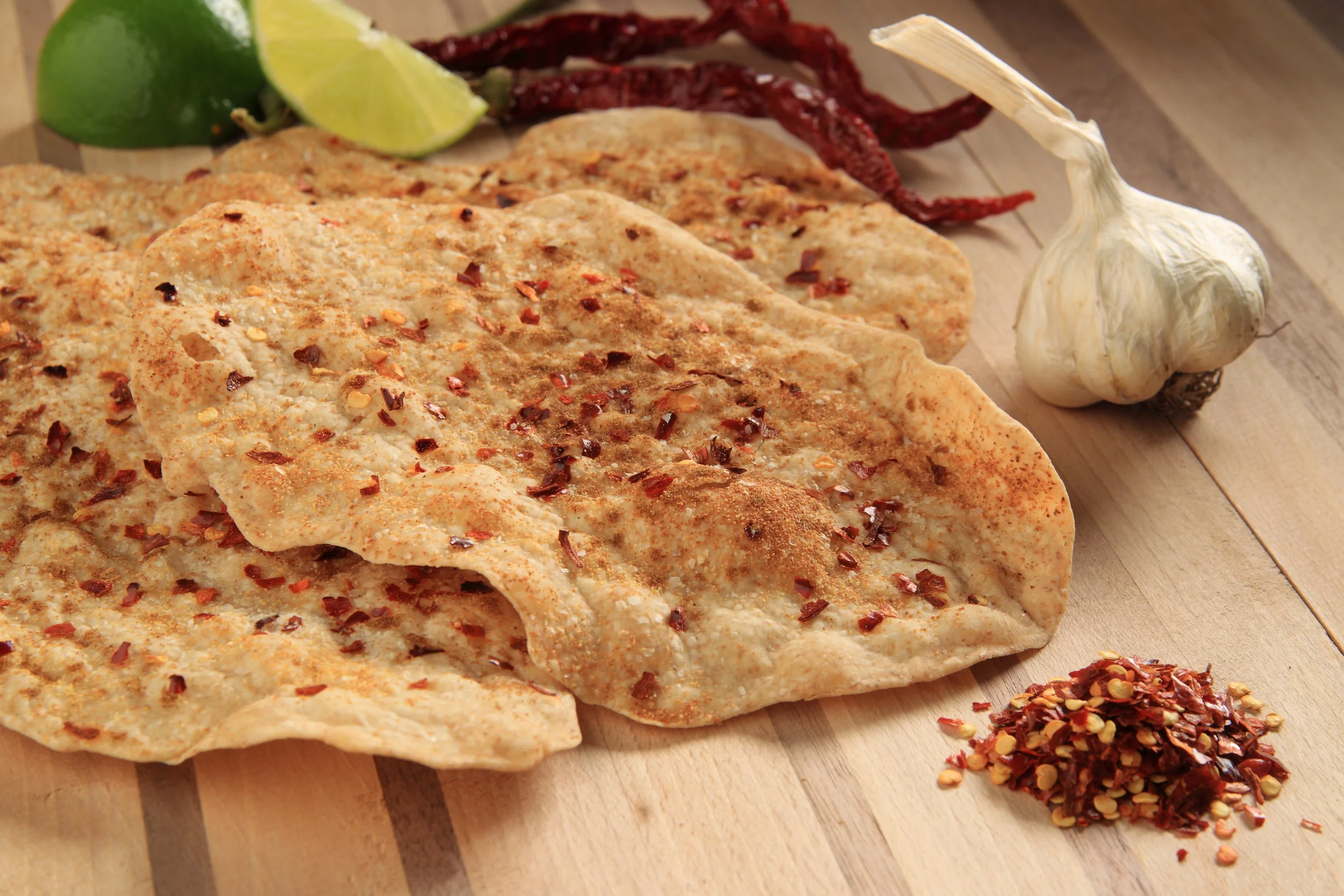 Seasoned flatbread crackers with garlic, lime and chili